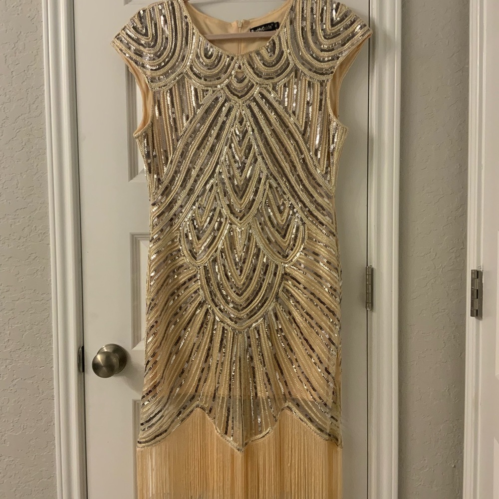 Gold and silver gown with tassels